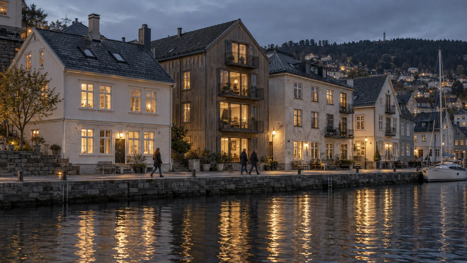 A west-Norwegian waterfront at blue hour with warmly lit apartment windows.